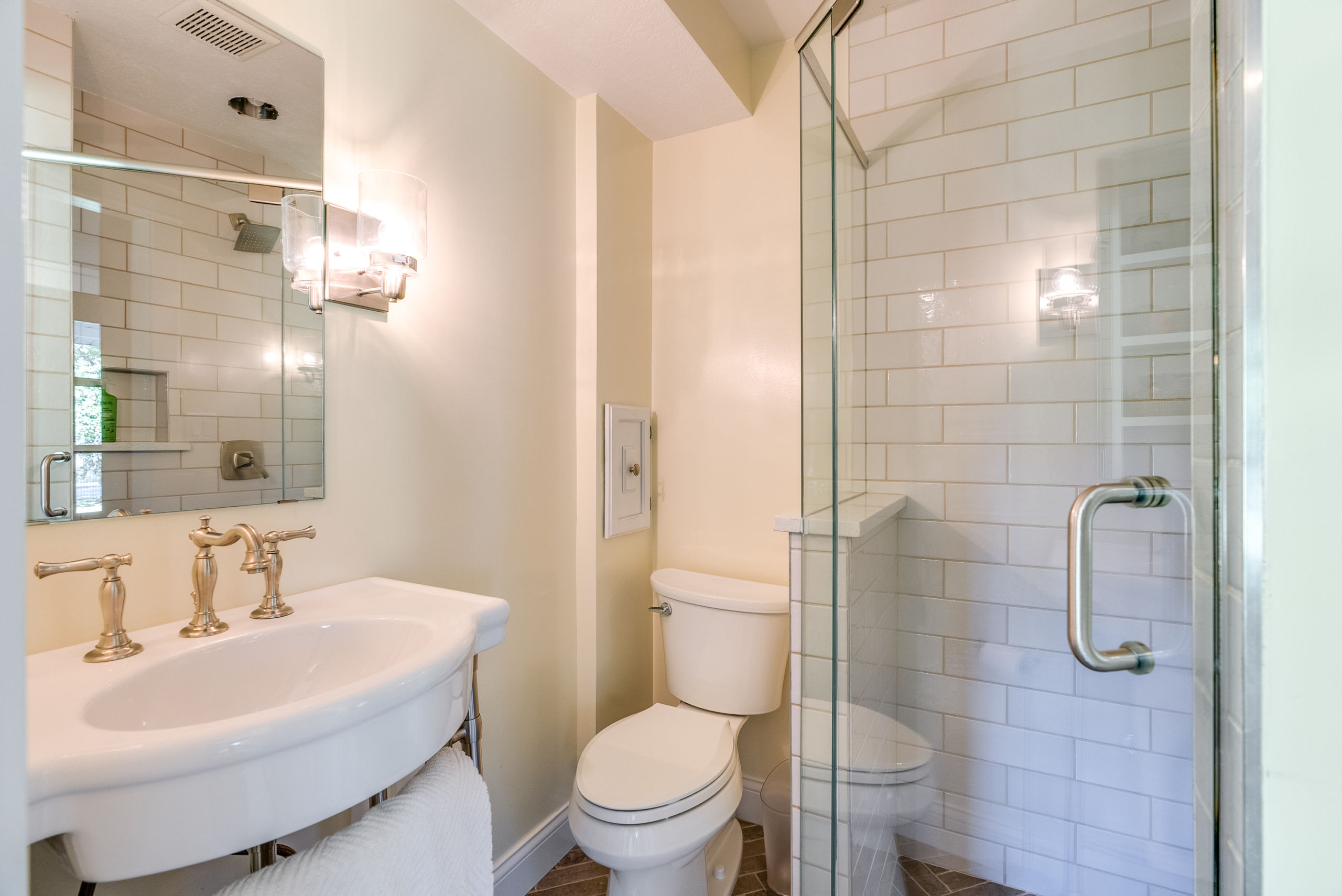 Complete Bathroom Remodel with intricate tiling, a walk-in shower and molding