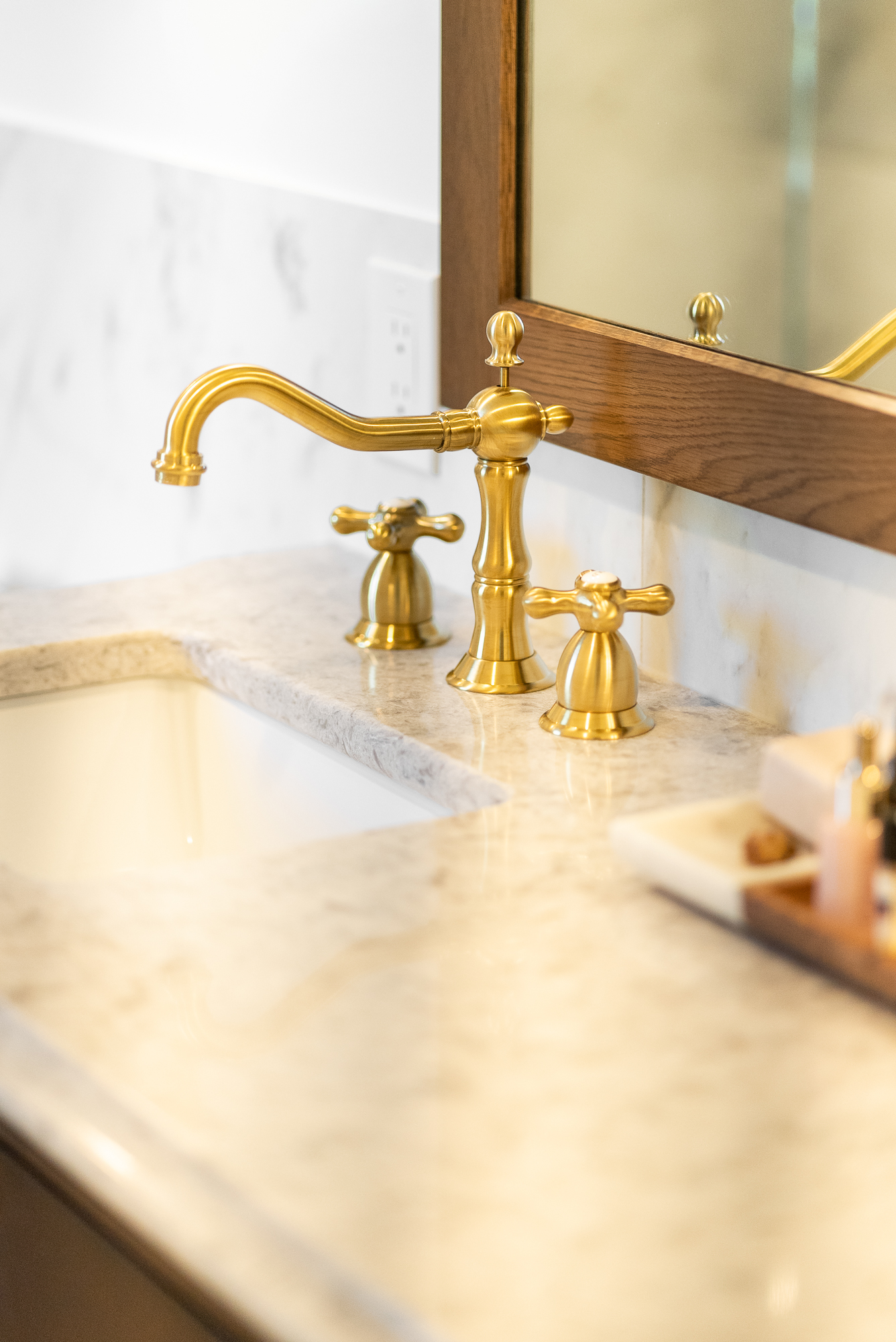 gold bathroom faucet in Boston Heights